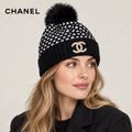 Chanel hat worn by a female model, showing the hat shape and detailing.