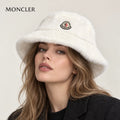 Moncler hat worn by a female model, showing the hat shape and detailing.