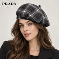 Prada hat worn by a female model, showing the hat shape and detailing.