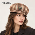 Prada hat worn by a female model, showing the hat shape and detailing.
