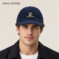 Louis Vuitton hat worn by a male model, showing the hat shape and detailing.
