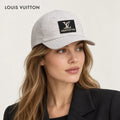 Louis Vuitton hat worn by a female model, showing the hat shape and detailing.