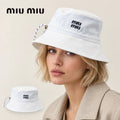 miu miu bucket hat worn by a female model, with product detail inset.