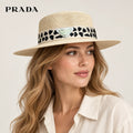 Prada hat worn by a female model, showing the hat shape and detailing.