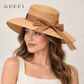 Gucci hat worn by a female model, showing the hat shape and detailing.