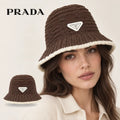 PRADA bucket hat worn by a female model, with product detail inset.