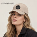 Canada Goose hat worn by a female model, showing the hat shape and detailing.