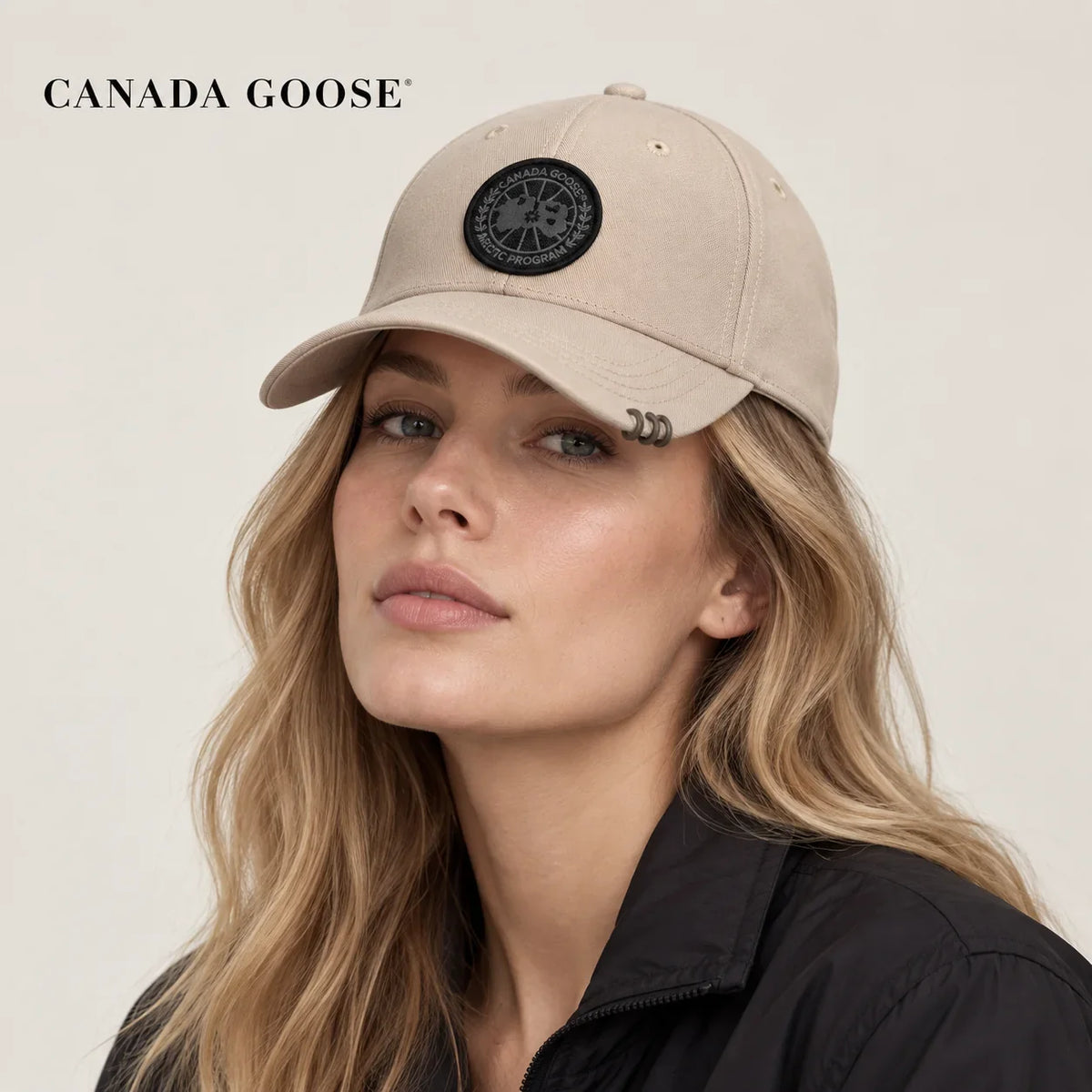 Canada Goose hat worn by a female model, showing the hat shape and detailing.