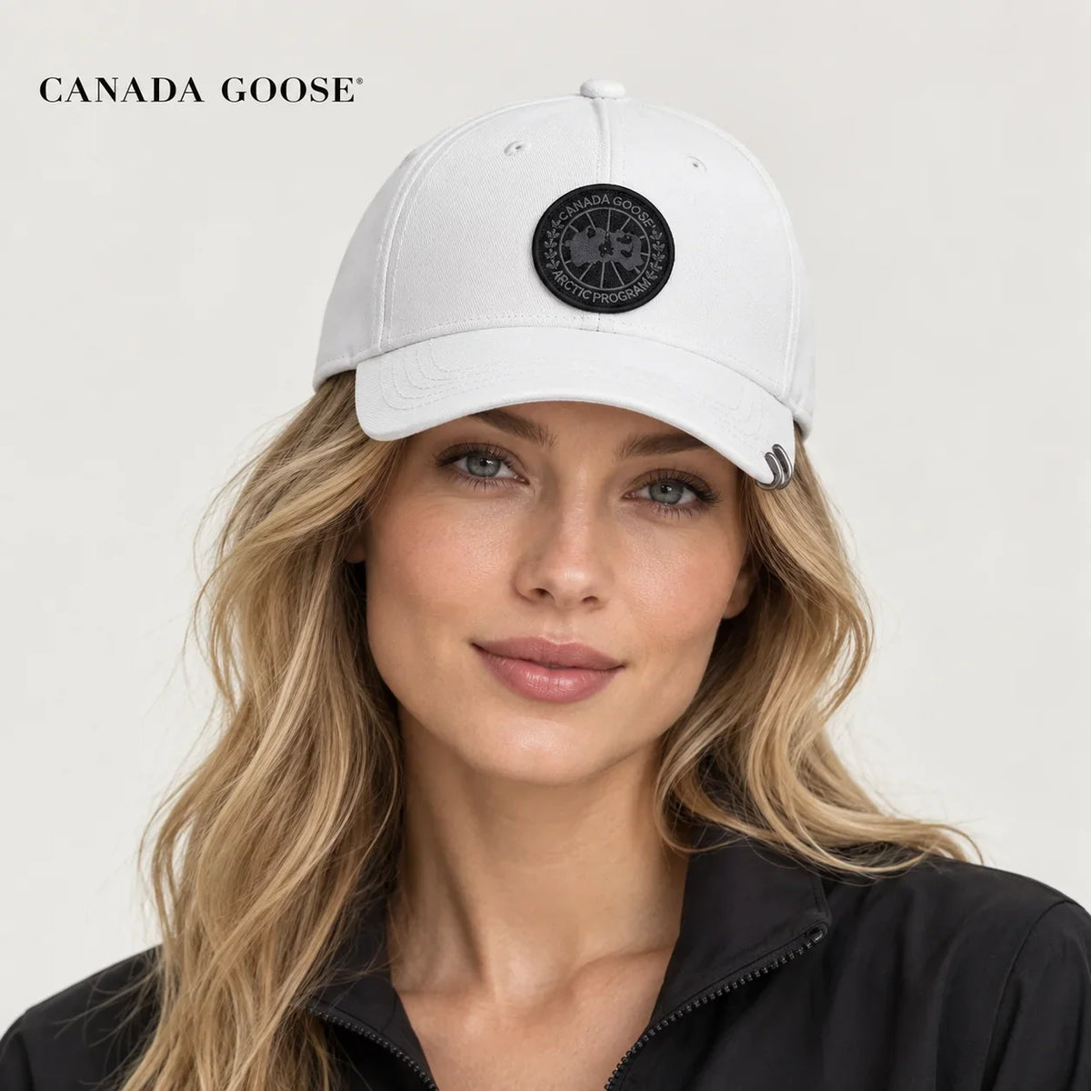 Canada Goose hat worn by a female model, showing the hat shape and detailing.