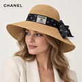 Chanel hat worn by a female model, showing the hat shape and detailing.