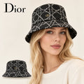 Dior bucket hat worn by a female model, with product detail inset.