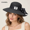 Chanel hat worn by a female model, showing the hat shape and detailing.