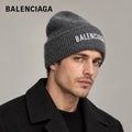 Balenciaga ribbed knit beanie worn by an adult male model