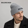 Balenciaga ribbed knit beanie worn by an adult male model