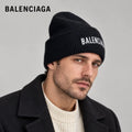 Balenciaga ribbed knit beanie worn by an adult male model