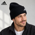 Adidas ribbed knit beanie worn by an adult male model