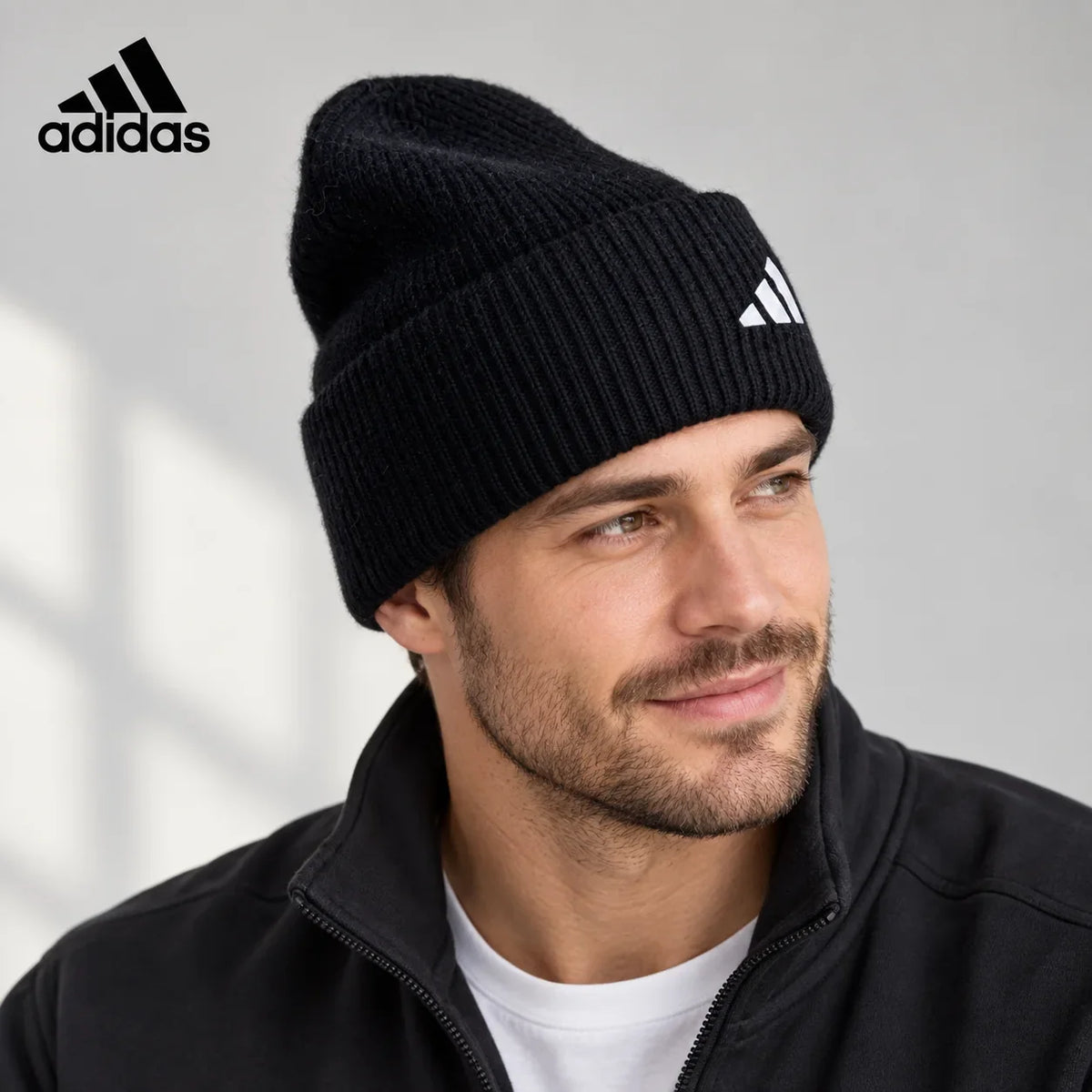 Adidas ribbed knit beanie worn by an adult male model
