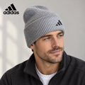 Adidas ribbed knit beanie worn by an adult male model
