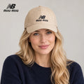 NB / miu miu baseball cap worn by an adult female model