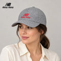 NB / miu miu baseball cap worn by an adult female model