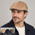 Flat cap worn by an adult male model with a multicolor product inset