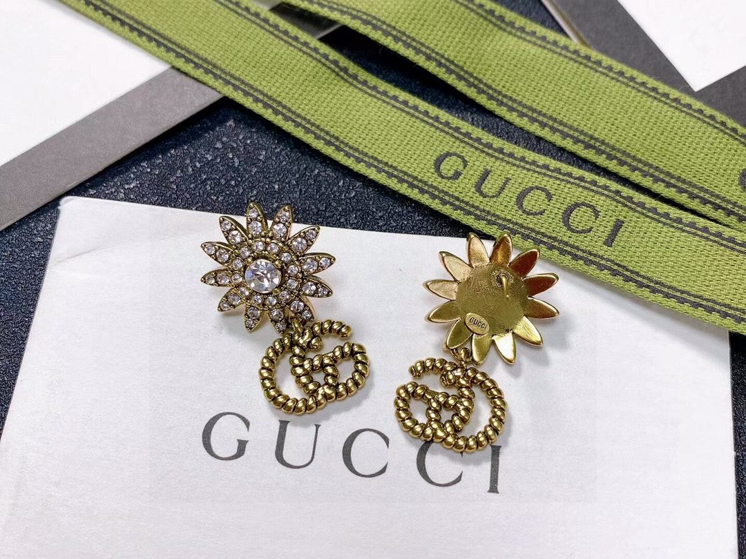 Gucci Gold-Tone Sunburst and GG Drop Earrings - album image 3