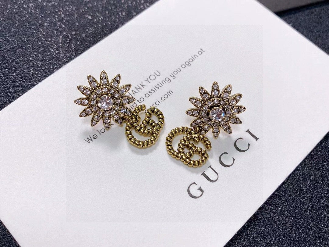 Gucci Gold-Tone Sunburst and GG Drop Earrings - album image 2