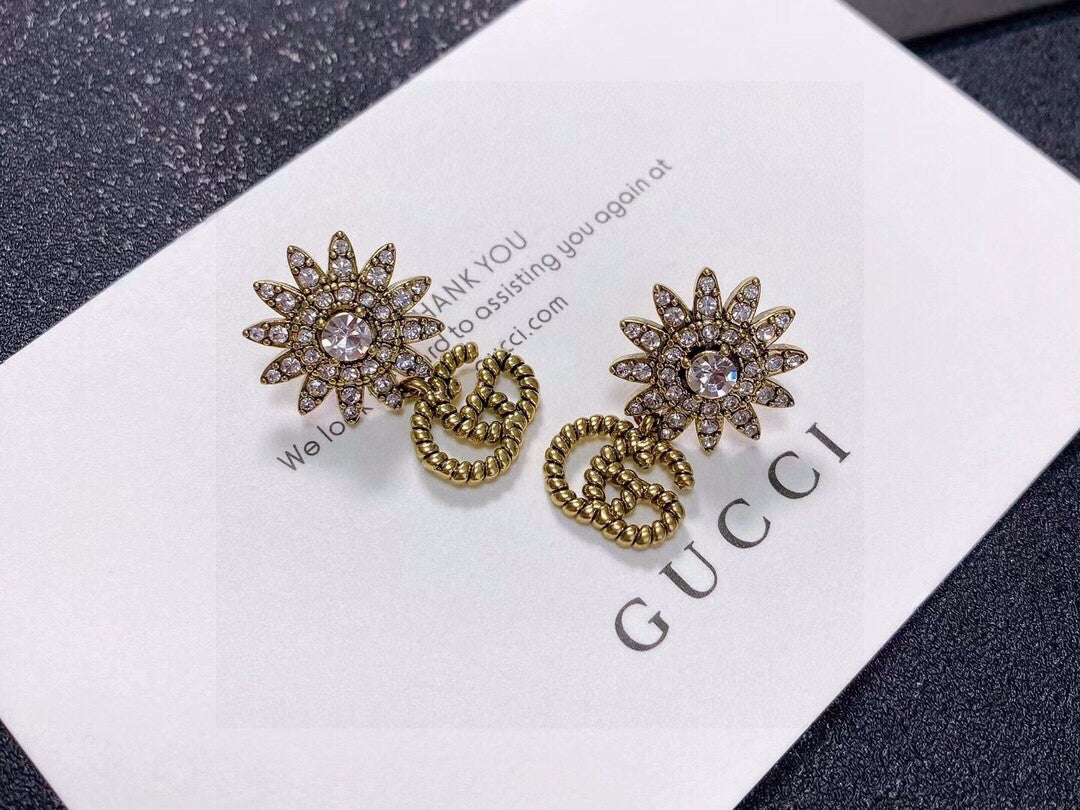 Gucci Gold-Tone Sunburst and GG Drop Earrings - album image 6
