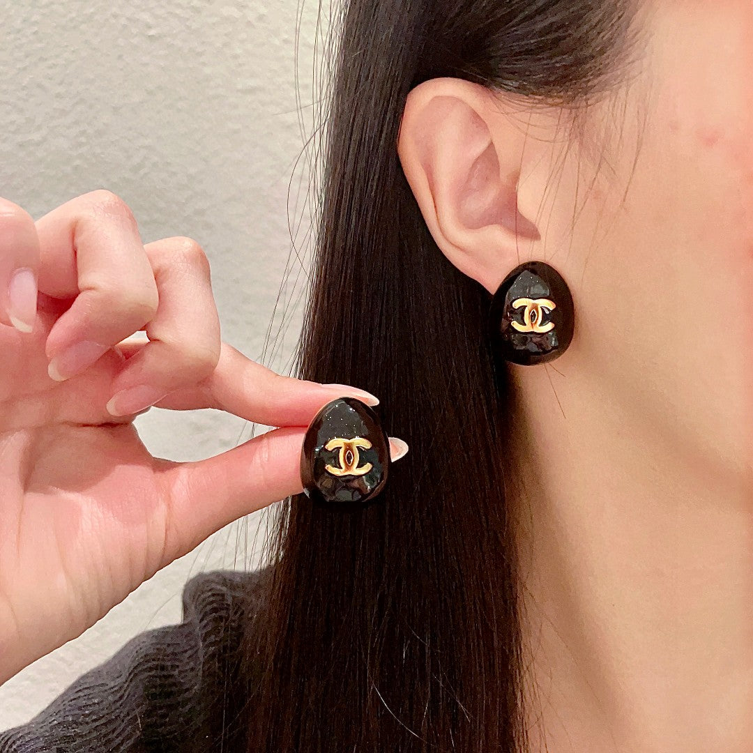 Chanel Interlocking C Stud Earrings - album image 1