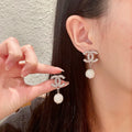 Chanel Interlocking C Crystal Accent Earrings - album image 1