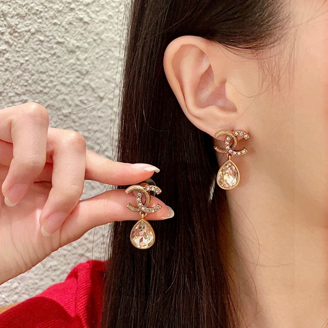 Chanel Interlocking C Crystal Accent Earrings - album image 1