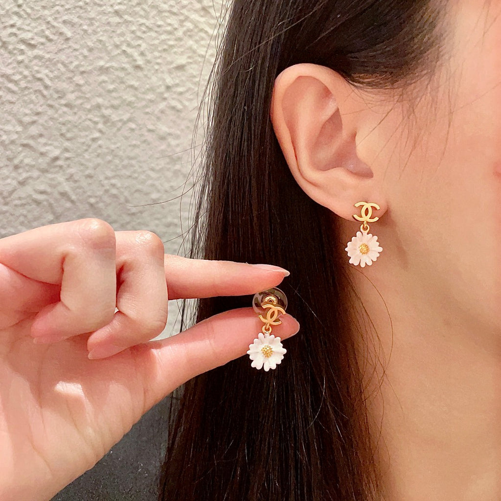 Chanel Interlocking C Camellia Earrings - album image 1