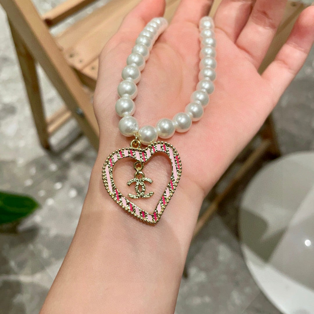 Chanel Interlocking C Pearl Heart Necklace - album image 4