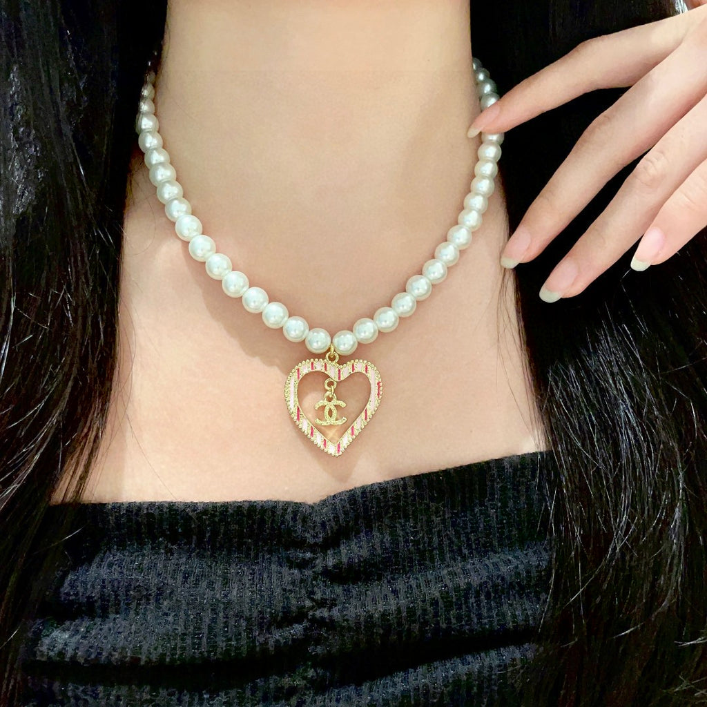 Chanel Interlocking C Pearl Heart Necklace - album image 1