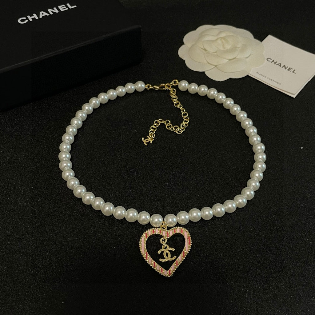 Chanel Interlocking C Pearl Heart Necklace - album image 9