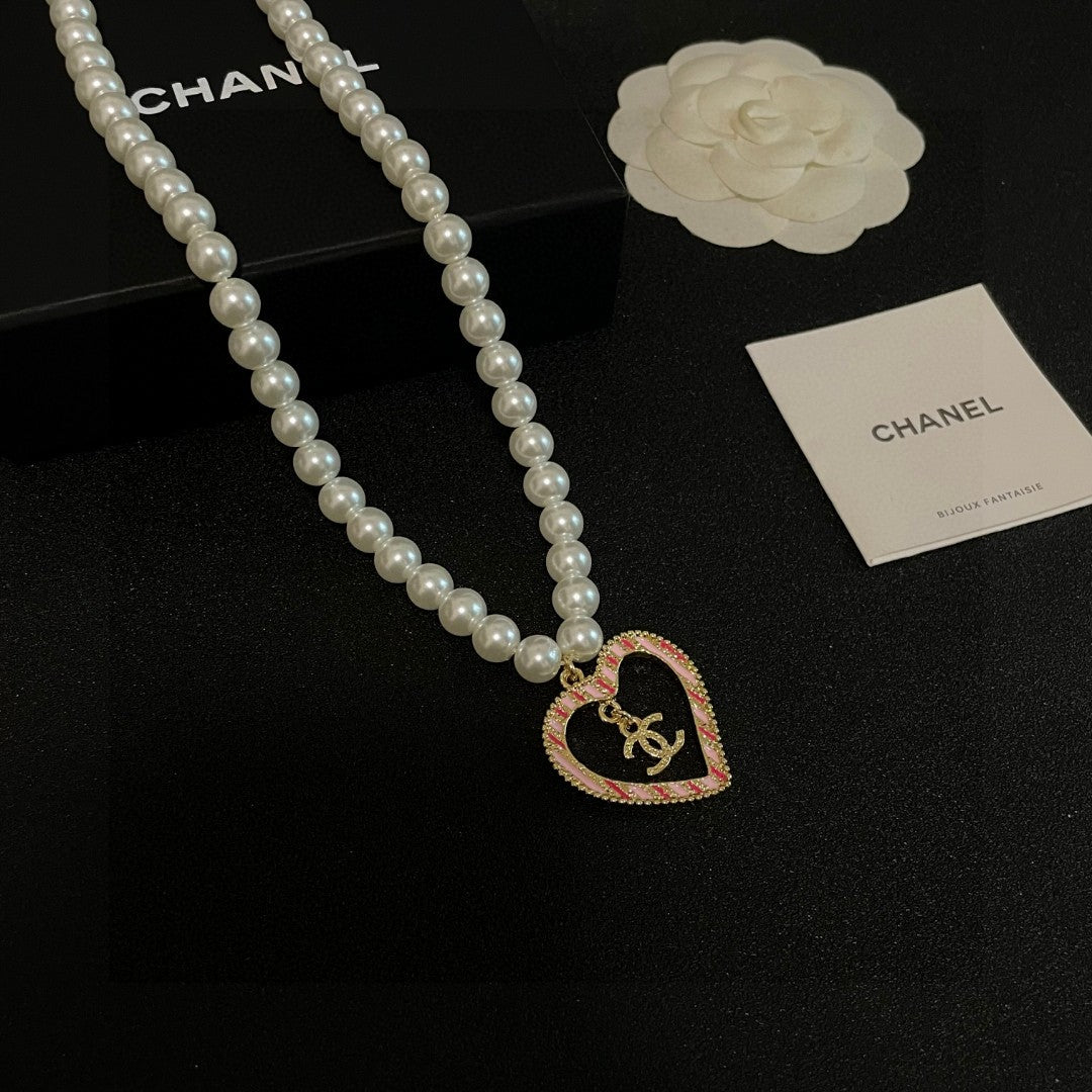 Chanel Interlocking C Pearl Heart Necklace - album image 6
