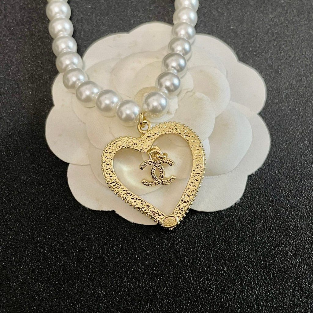 Chanel Interlocking C Pearl Heart Necklace - album image 8