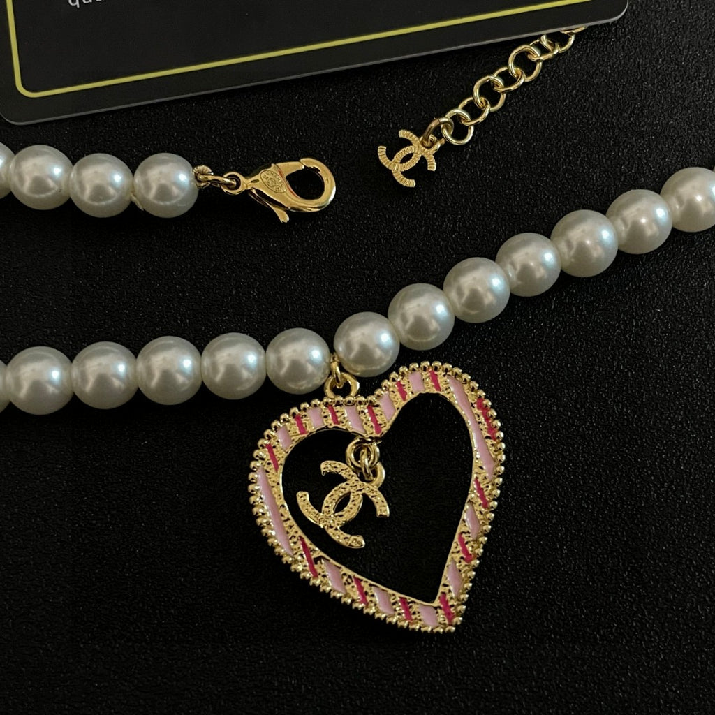Chanel Interlocking C Pearl Heart Necklace - album image 7