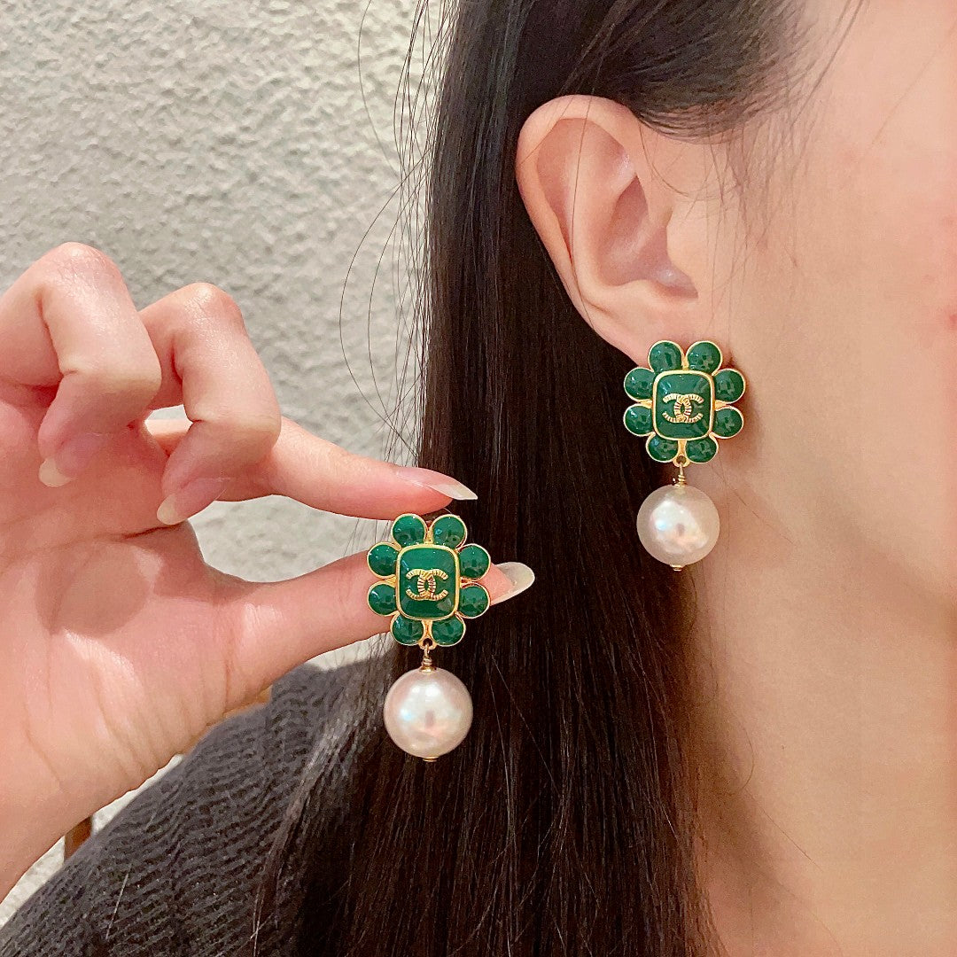 Chanel Interlocking C Pearl Earrings - album image 1