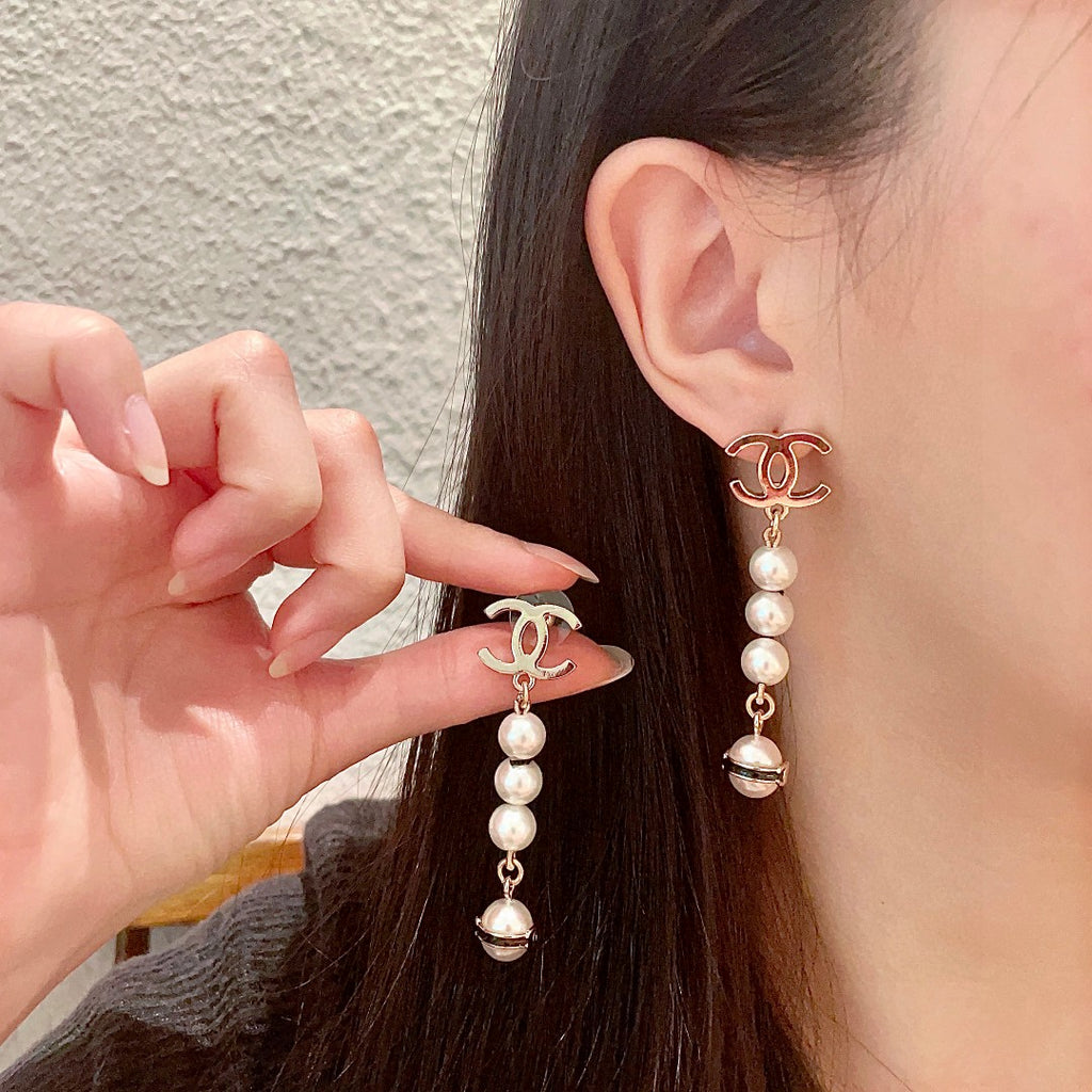 Chanel Interlocking C Pearl Earrings - album image 1