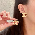 Chanel Interlocking C Stud Earrings - album image 1