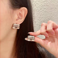 Chanel Interlocking C Letter Stud Earrings - album image 1