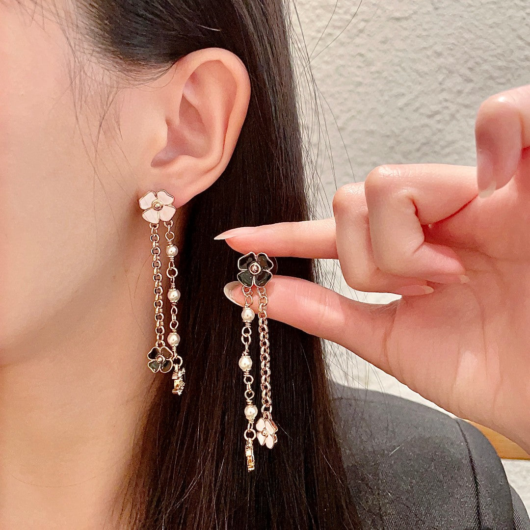 Chanel Interlocking C Camellia Earrings - album image 1