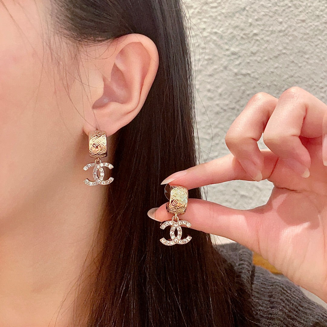 Chanel Interlocking C Crystal Accent Earrings - album image 1