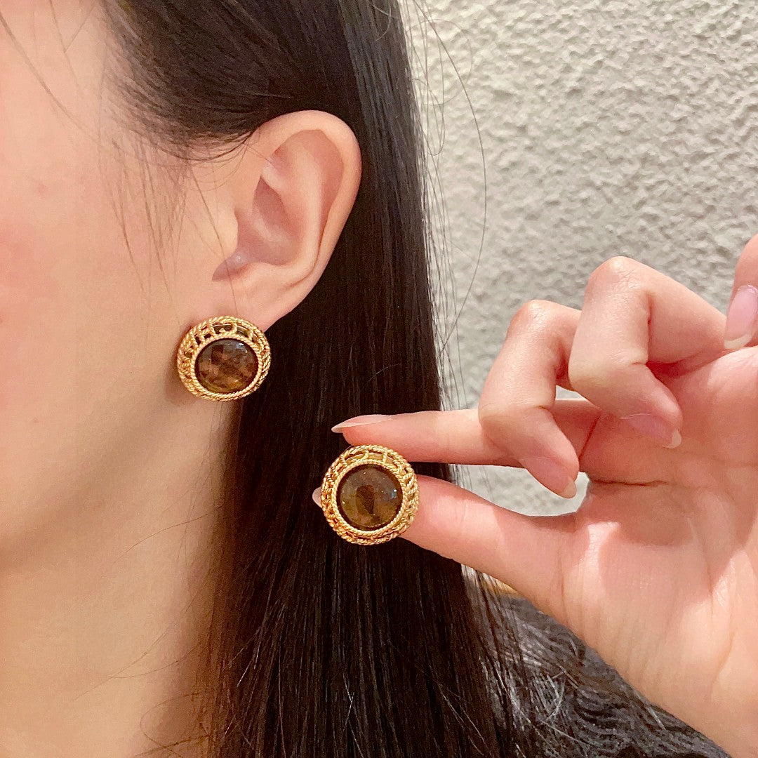Chanel Interlocking C Stud Earrings - album image 1