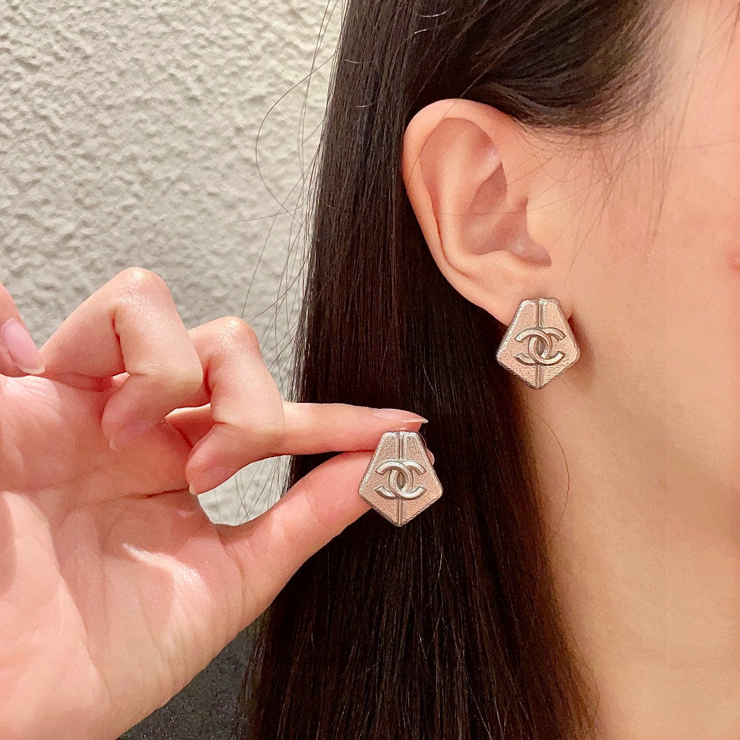 Chanel Interlocking C Stud Earrings - album image 1