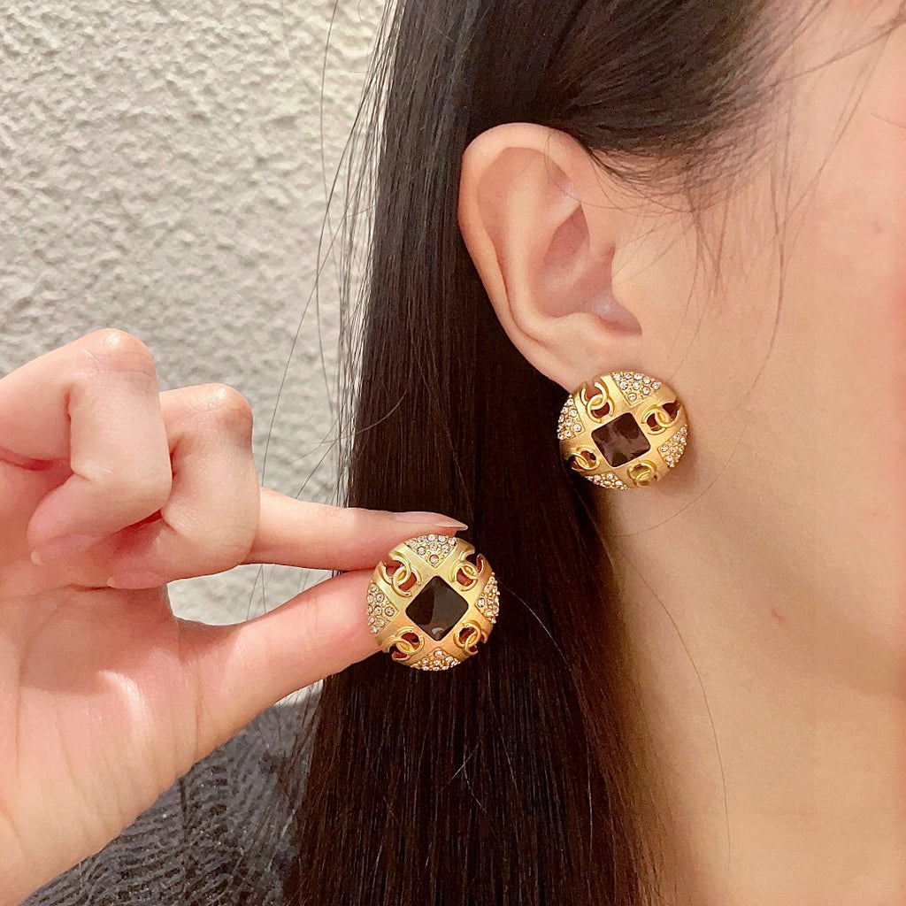 Chanel Interlocking C Crystal Accent Stud Earrings - album image 1