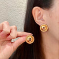 Chanel Interlocking C Stud Earrings - album image 1