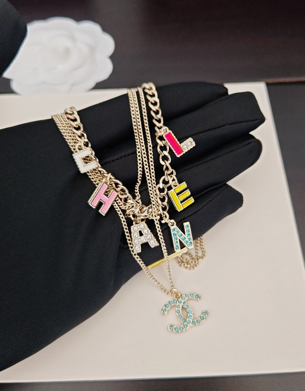 Chanel White Letter Necklace - album image 1