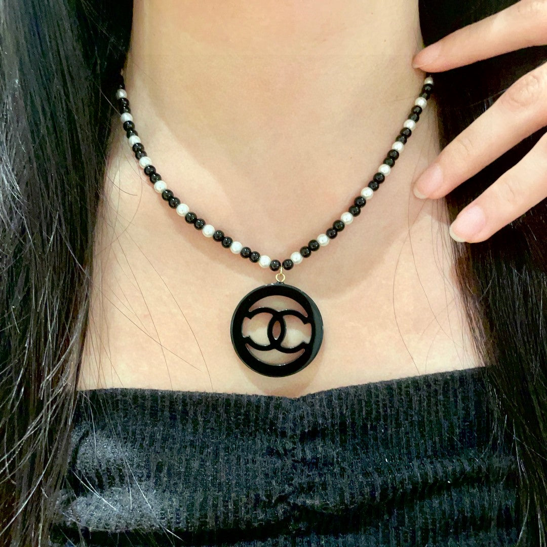Chanel Interlocking C Pearl Necklace - album image 1